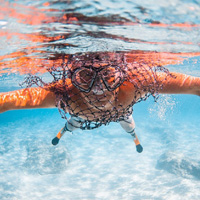 A view of Josh Bogle from under water while SCUBA diving.