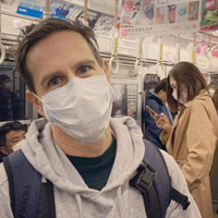 Jonesy takes a selfie while wearing a face mask on a Japanese subway.